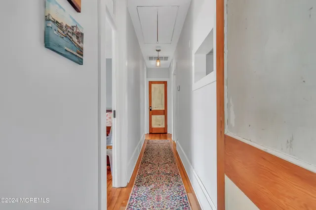 a view of a hallway with windows