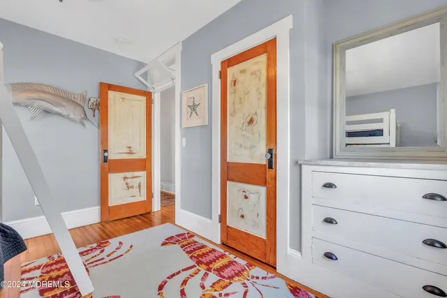 a bedroom with a bed and a dresser