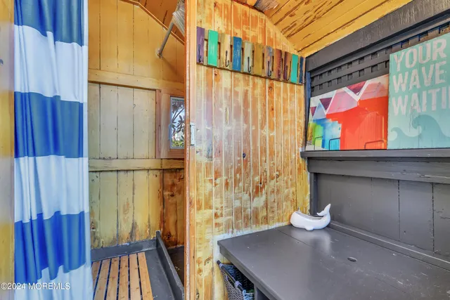a view of a room with furniture and wooden floor
