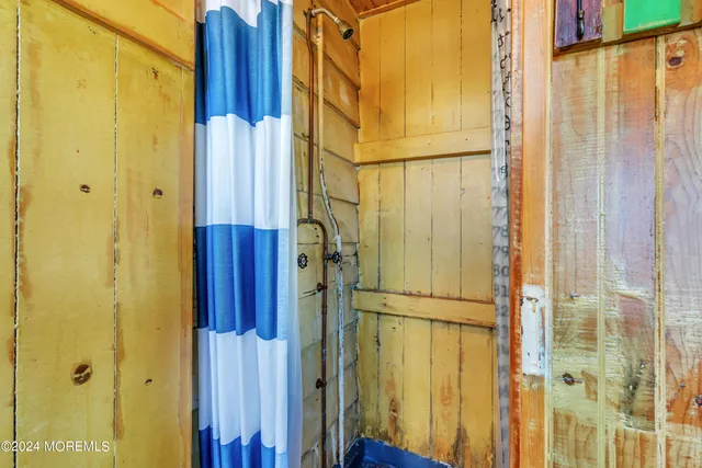 a bathroom with a toilet a sink and a shower