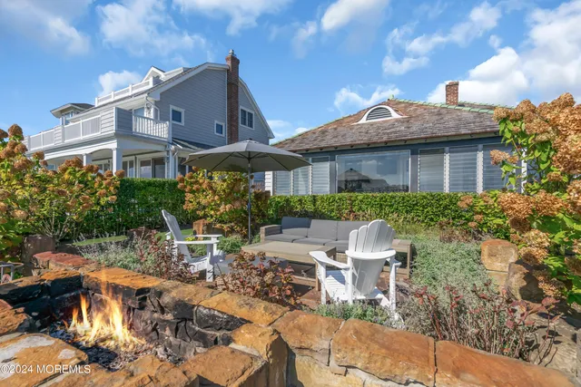 an aerial view of a house with a lake view