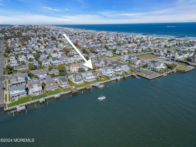 an aerial view of a city with ocean view