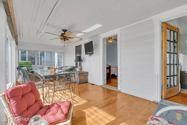a living room with furniture a window and a table