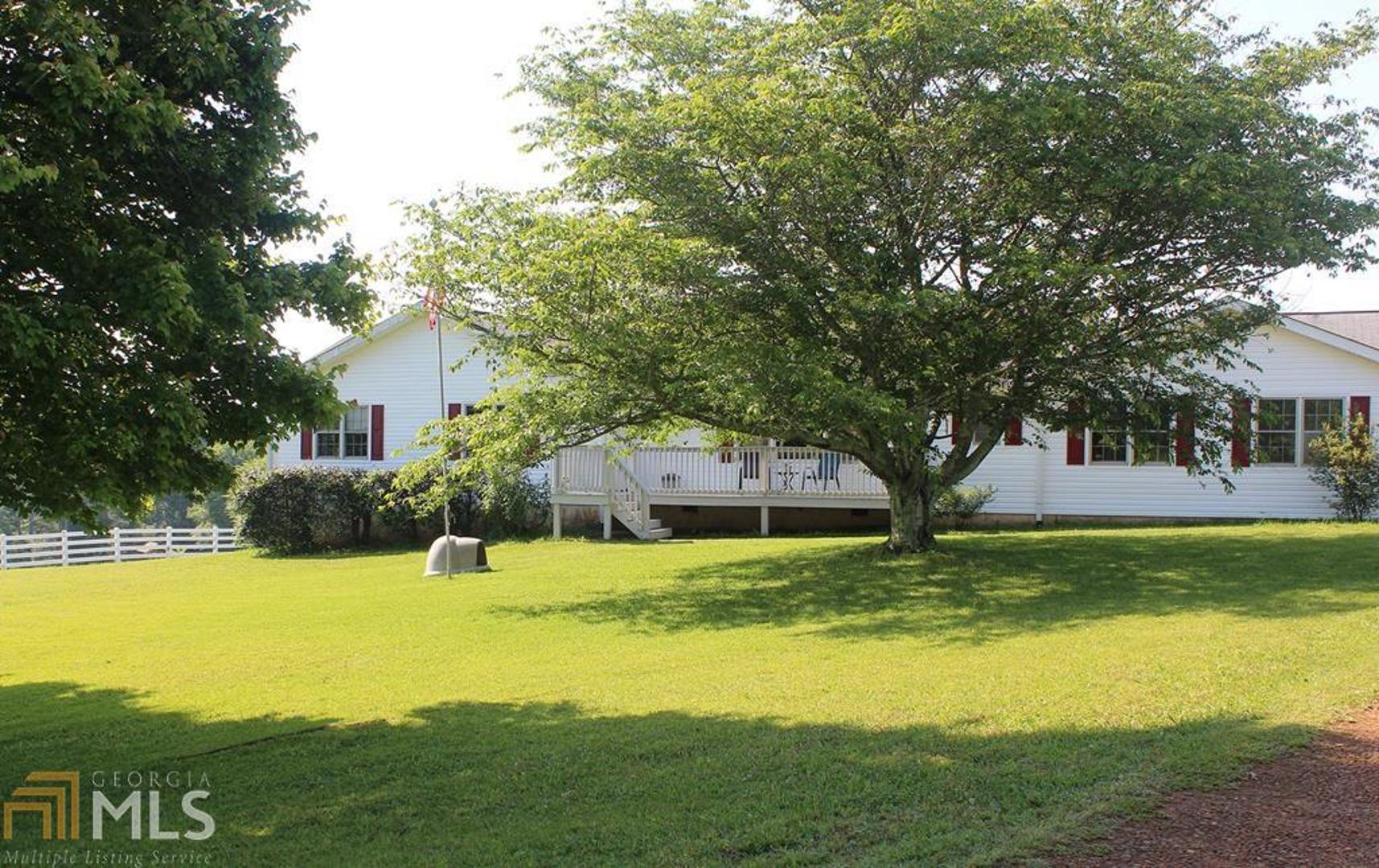 a house view with swimming pool