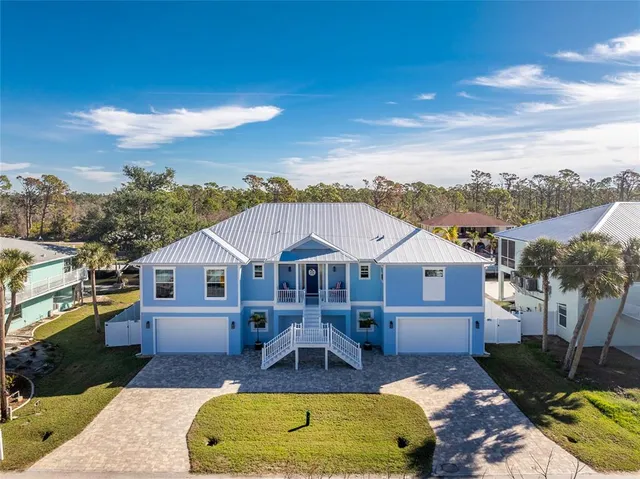 a view of a house with swimming pool and porch