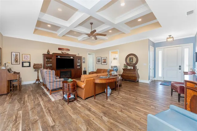a kitchen with stainless steel appliances granite countertop a stove and chairs