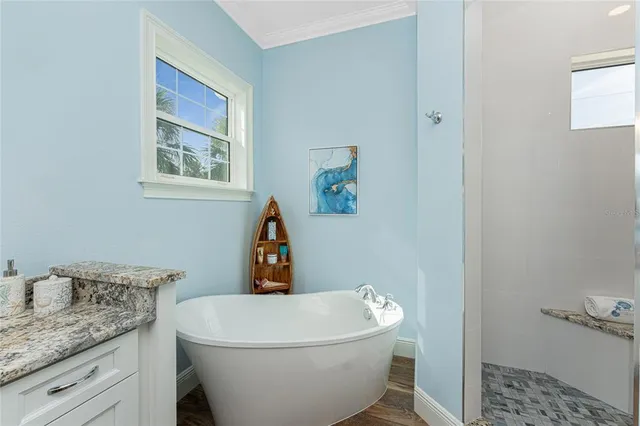 a bathroom with a granite countertop toilet a sink and a mirror