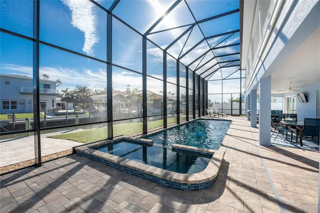 a picture of a city with lots of residential buildings ocean and mountain view in back