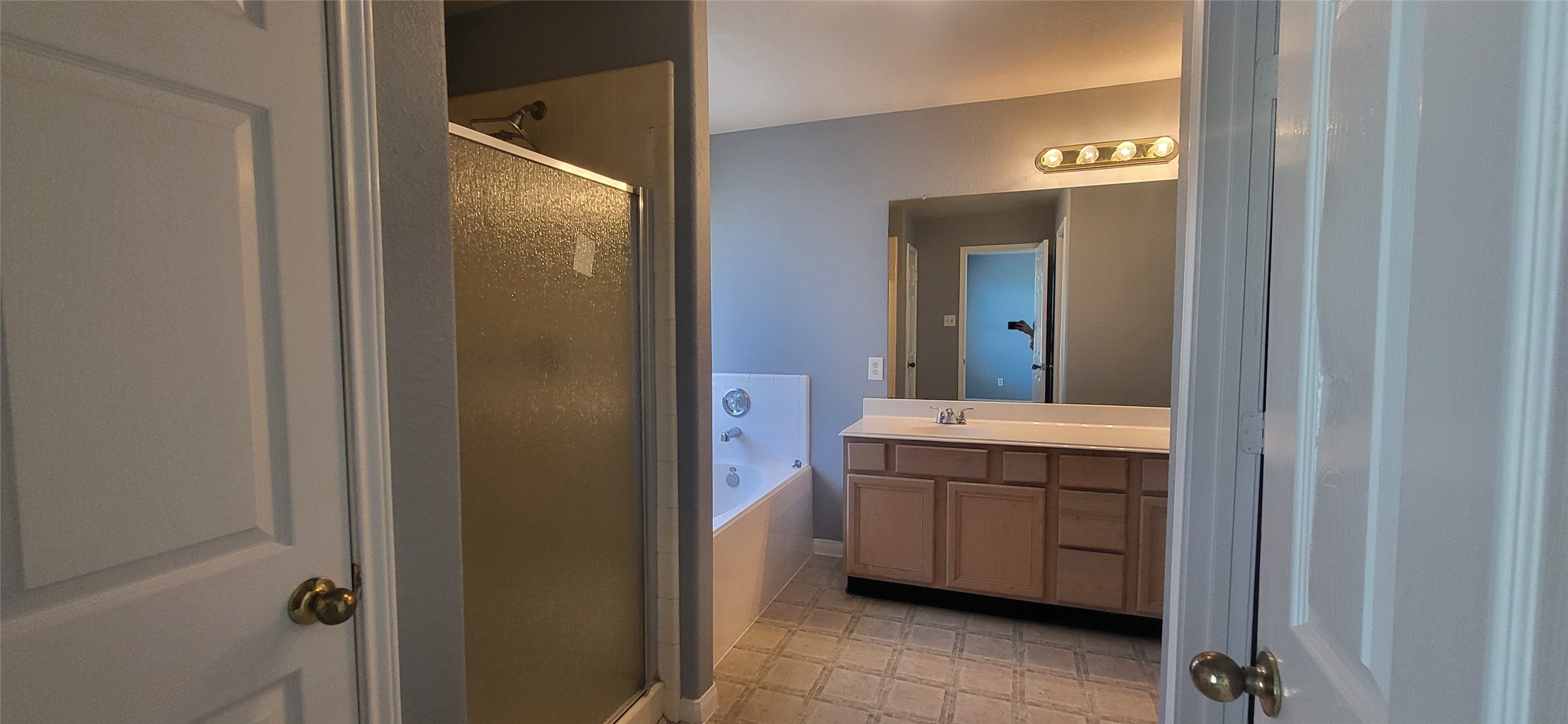 24022 Rockygate Drive Spring, TX 77373 - Photo 7 of 12 a bathroom with a sink and mirror