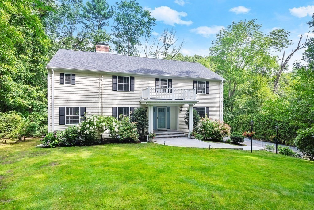 25 Hubbard Road Weston, MA 02493 - Photo 1 of 38 a front view of a house with a yard