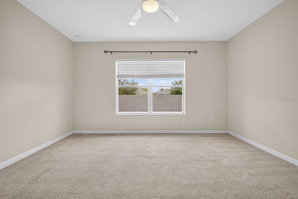 14239 Avenue Of The Groves Winter Garden, FL 34787 - Photo 11 of 54 an empty room with a window