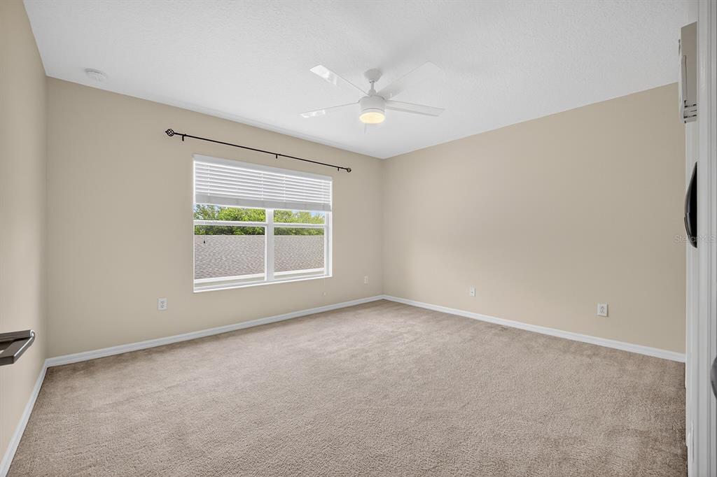 14239 Avenue Of The Groves Winter Garden, FL 34787 - Photo 15 of 54 a view of an empty room with a window