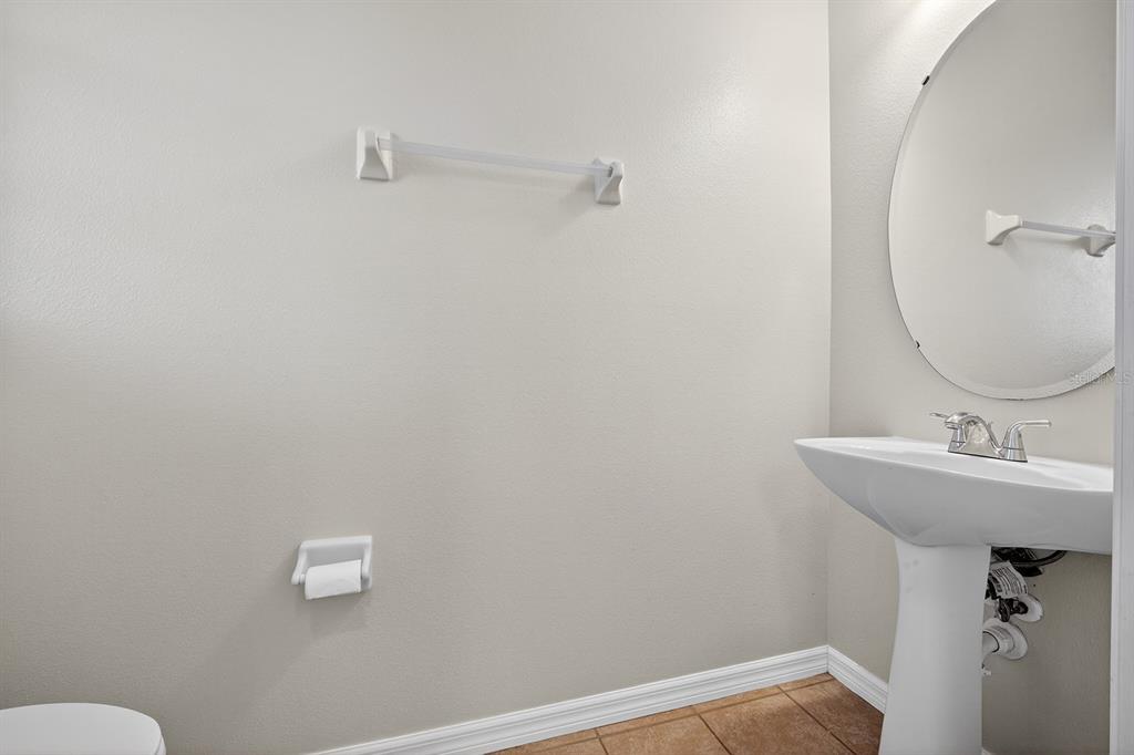 14239 Avenue Of The Groves Winter Garden, FL 34787 - Photo 21 of 54 a bathroom with a sink and a mirror