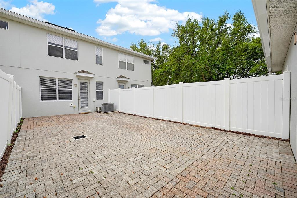 14239 Avenue Of The Groves Winter Garden, FL 34787 - Photo 23 of 54 a view of a house with a yard