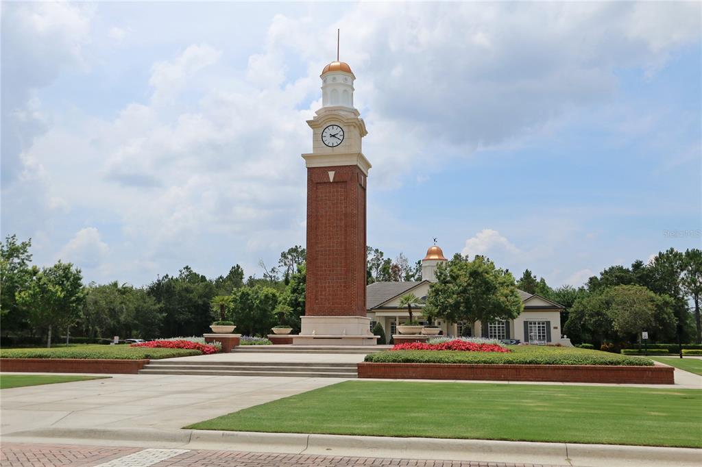 14239 Avenue Of The Groves Winter Garden, FL 34787 - Photo 30 of 54 a view of a tall building with a clock tower in the middle