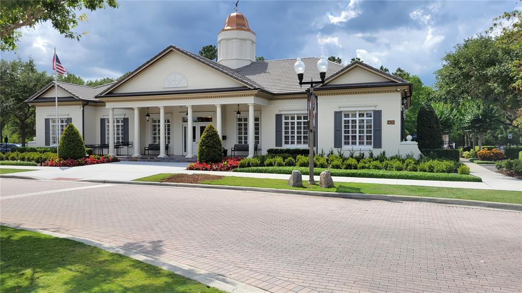14239 Avenue Of The Groves Winter Garden, FL 34787 - Photo 31 of 54 a view of a house with a yard and large trees