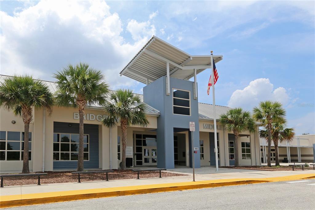 14239 Avenue Of The Groves Winter Garden, FL 34787 - Photo 40 of 54 a view of a building with a swimming pool