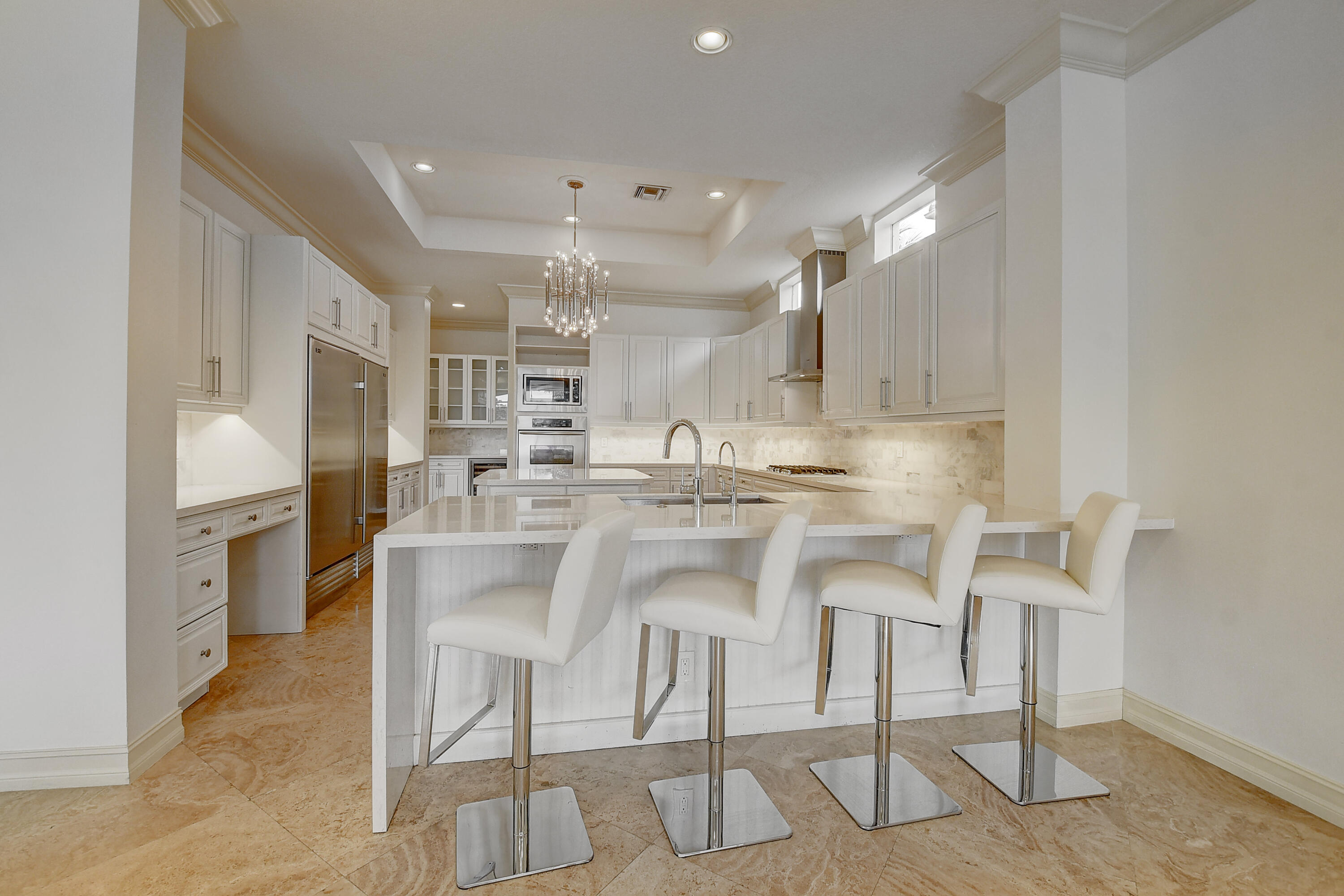 17698 Middlebrook Way Boca Raton, FL 33496 - Photo 14 of 68 a kitchen with kitchen island cabinets and chairs in it