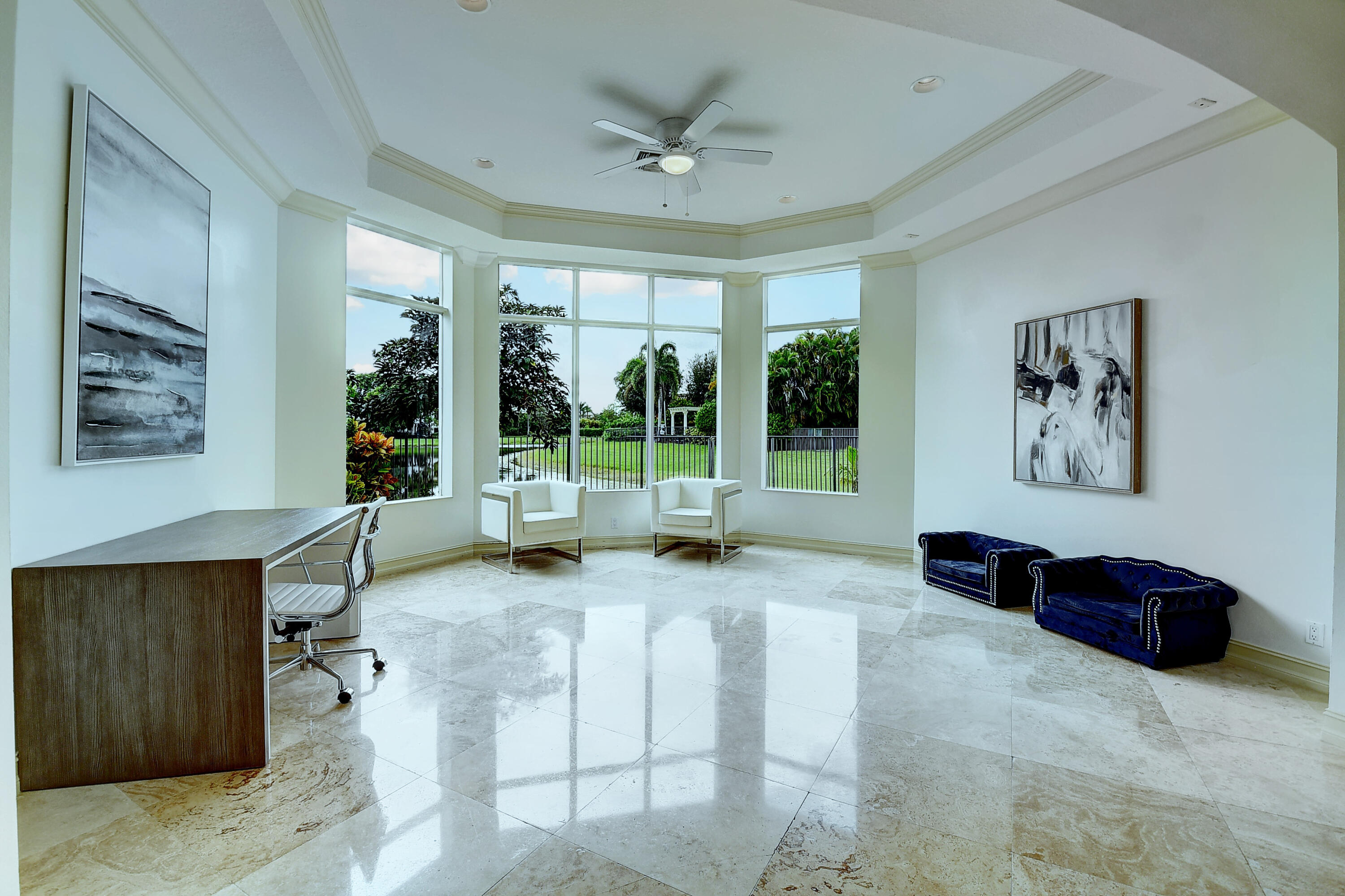 17698 Middlebrook Way Boca Raton, FL 33496 - Photo 18 of 68 a living room with furniture tv and a large window