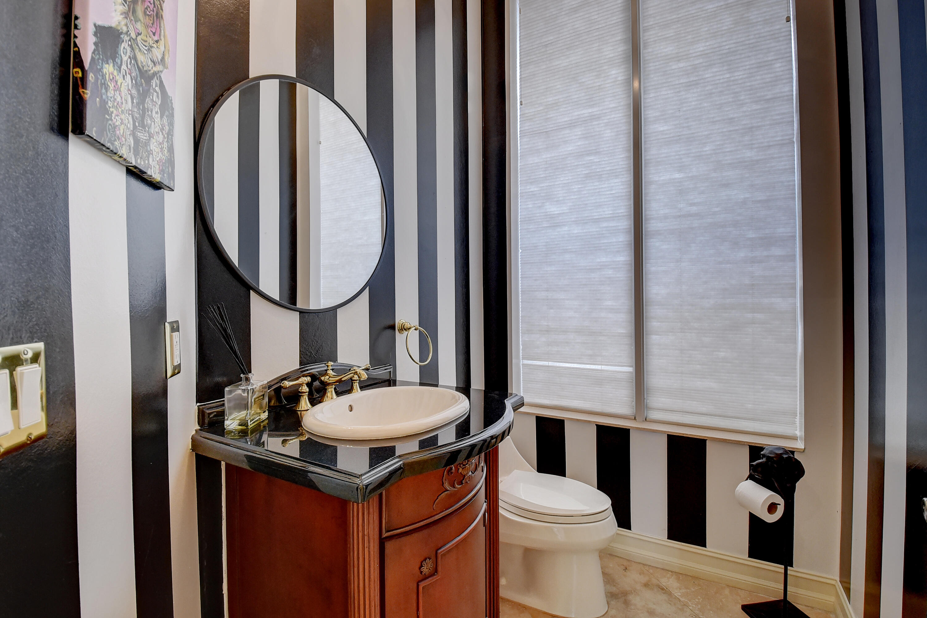 17698 Middlebrook Way Boca Raton, FL 33496 - Photo 24 of 68 a bathroom with a sink a toilet and a mirror