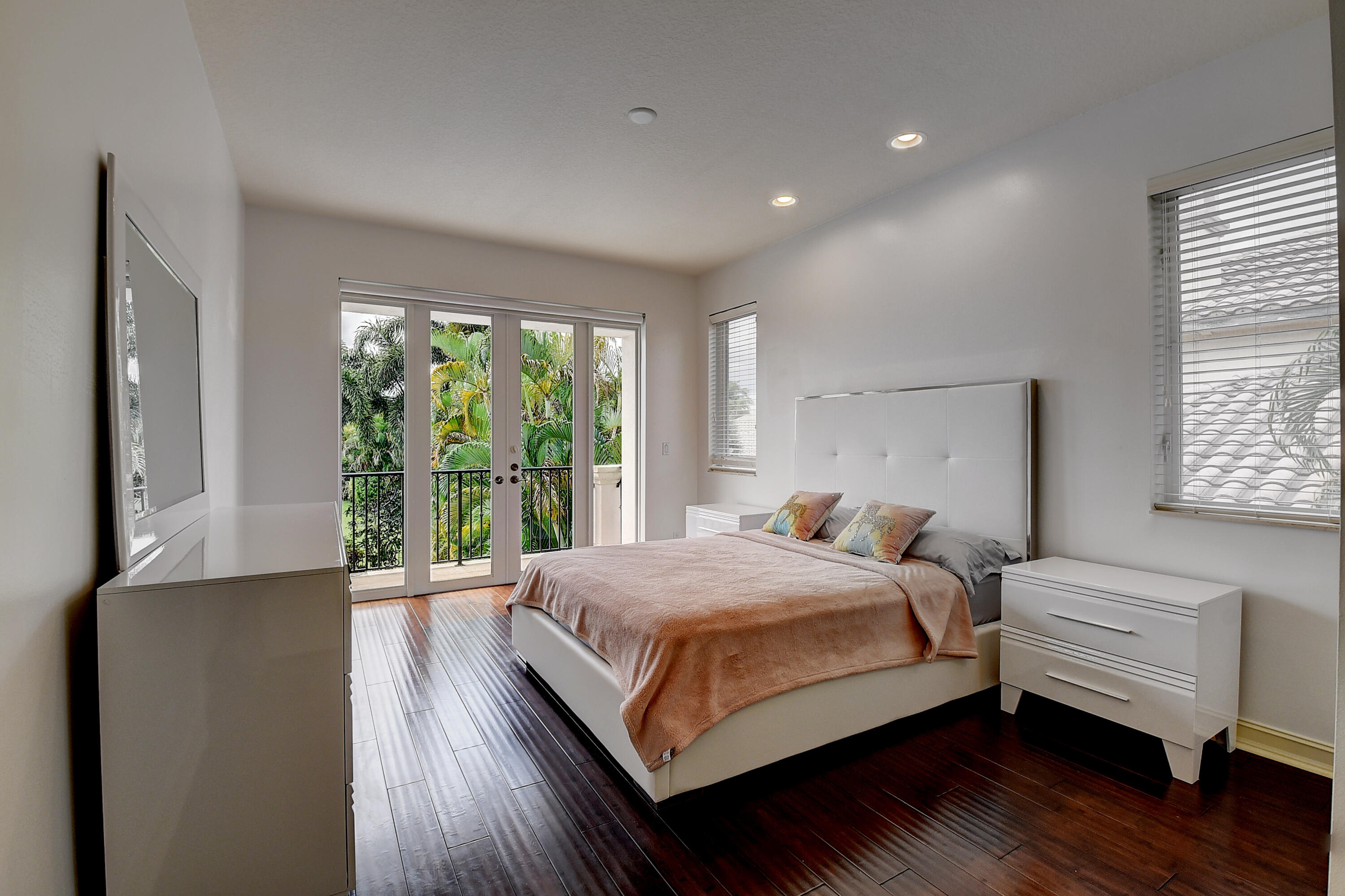 17698 Middlebrook Way Boca Raton, FL 33496 - Photo 39 of 68 a bedroom with a bed and wooden floor