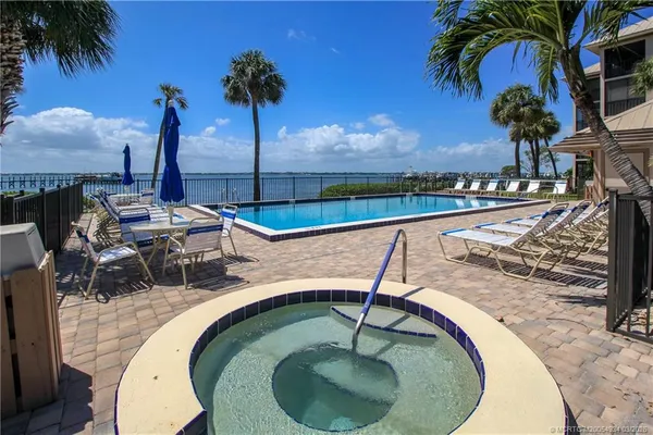 a view of a swimming pool with a patio