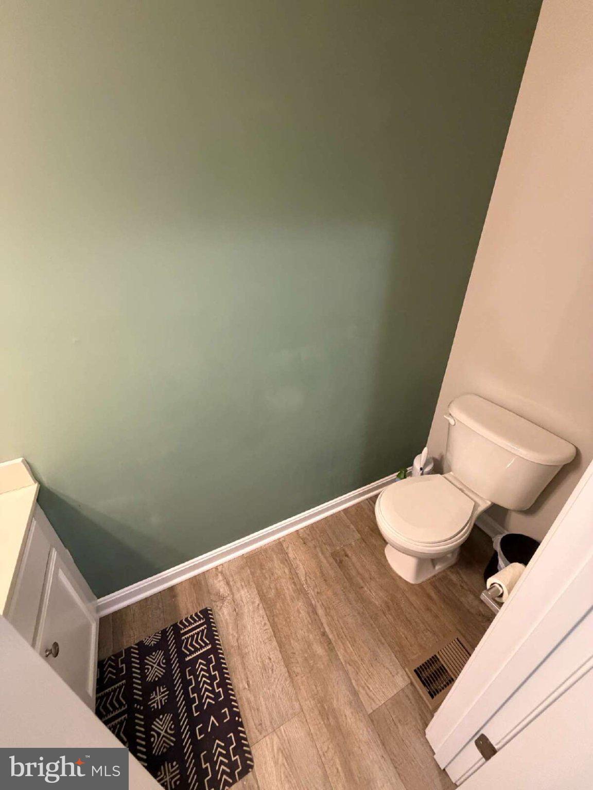 313 3rd Street Colonial Beach, VA 22443 - Photo 21 of 36 Chic half-bath with modern accents.