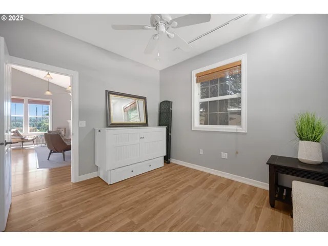 a view of a balcony with wooden floor and a lake view