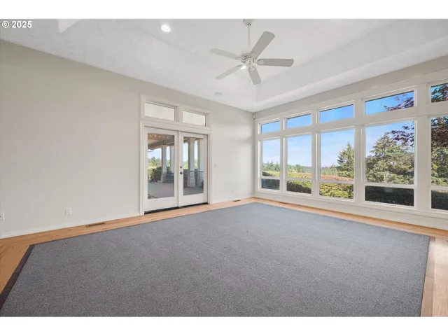 a large kitchen with stainless steel appliances kitchen island a large counter top and a sink