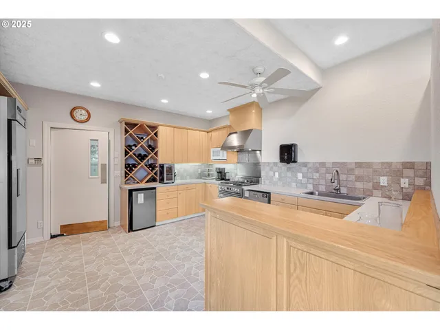 a spacious bathroom with a sink a mirror and a bathtub