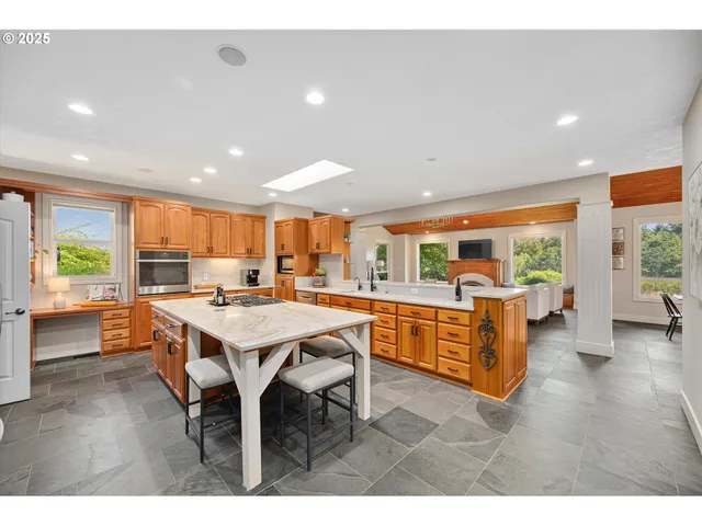 a kitchen with a stove a refrigerator and a sink