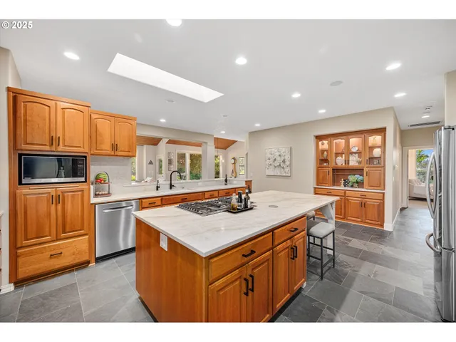 a spacious bedroom with a bed and a couch