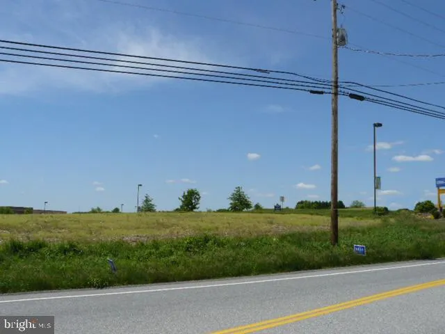 a view of a street with a building in the background