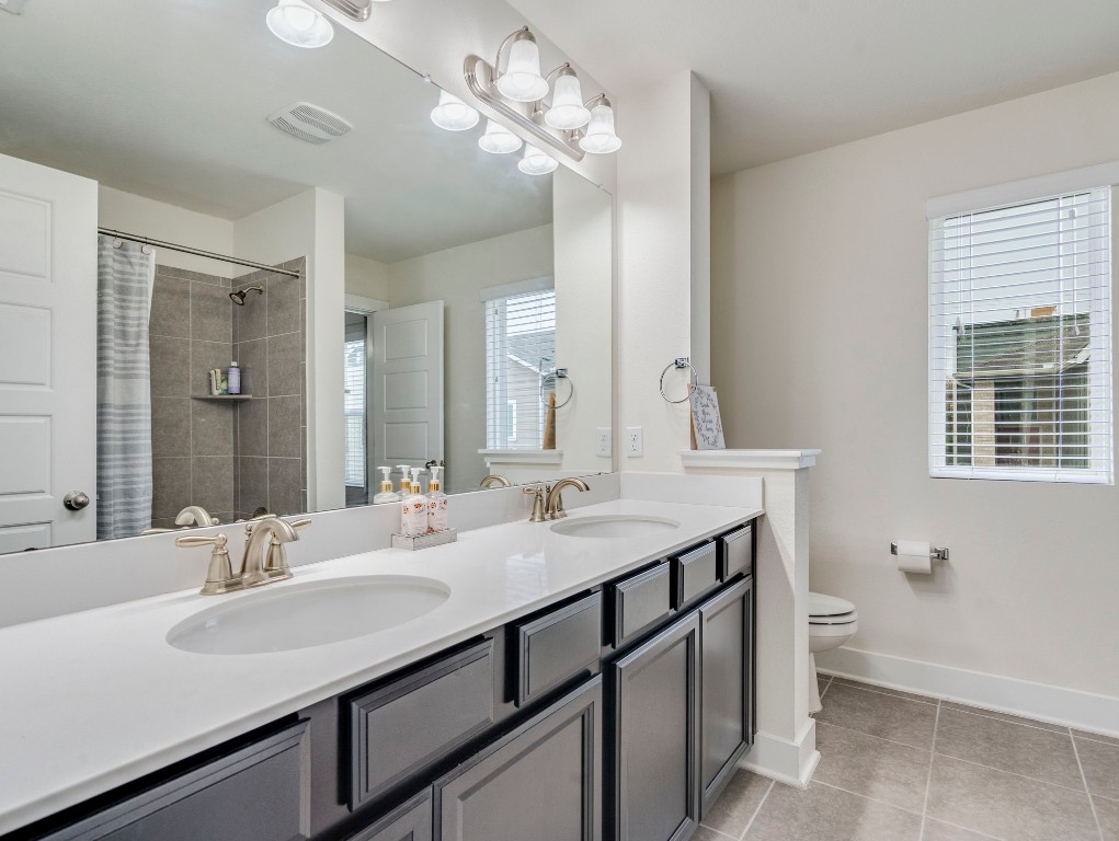 7408 Merrick Lane, Unit 42 Austin, TX 78745 - Photo 19 of 28 Full bathroom with double vanity