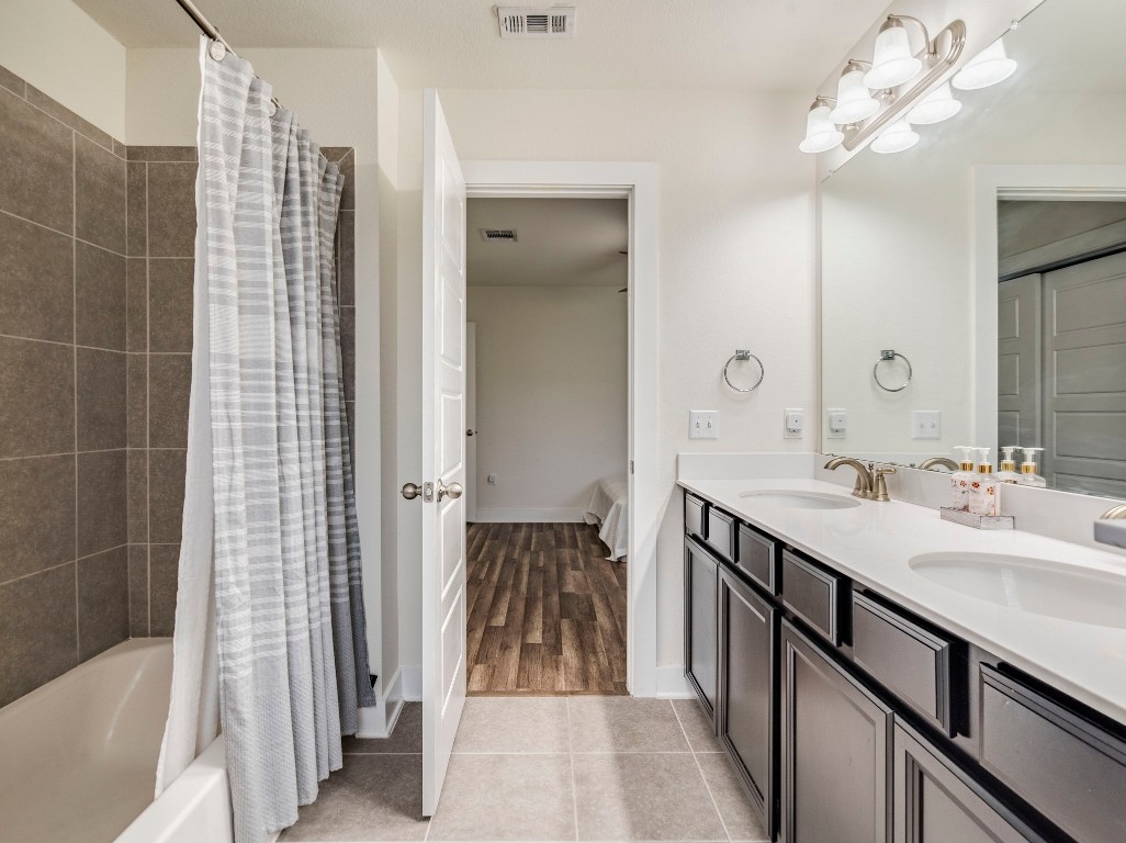 7408 Merrick Lane, Unit 42 Austin, TX 78745 - Photo 20 of 28 Bathroom with shower / bathtub combination with curtain