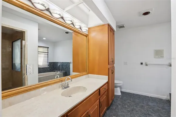 a kitchen with stainless steel appliances a stove a sink and a refrigerator