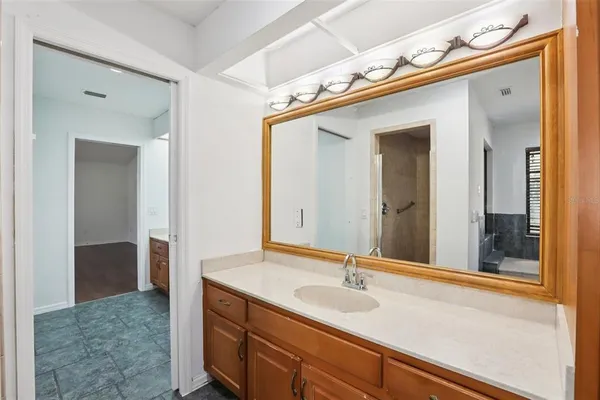a kitchen with stainless steel appliances granite countertop a sink and a stove