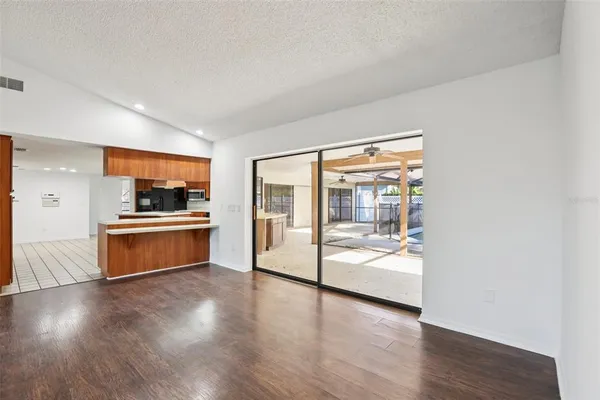 a kitchen with a sink counter top space and refrigerator