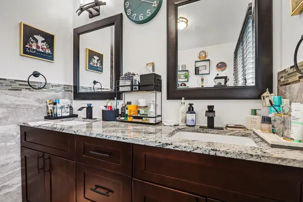 a bathroom with sink and a mirror