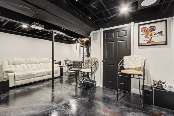 a dining room with furniture and a window
