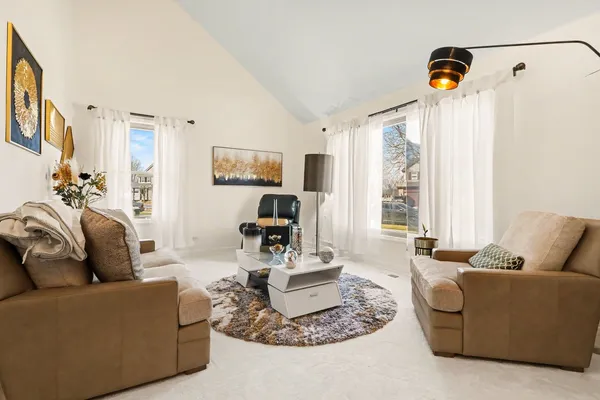 a living room with furniture and a table