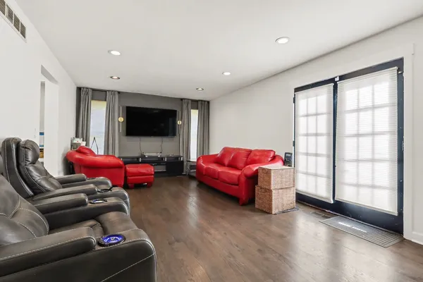 a living room with furniture window and flat screen tv