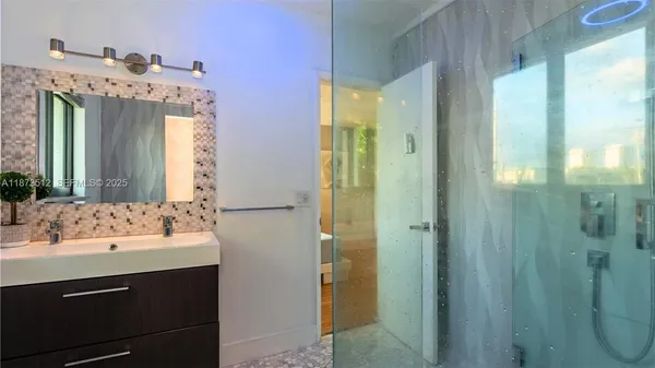 a bathroom with a sink vanity and a mirror