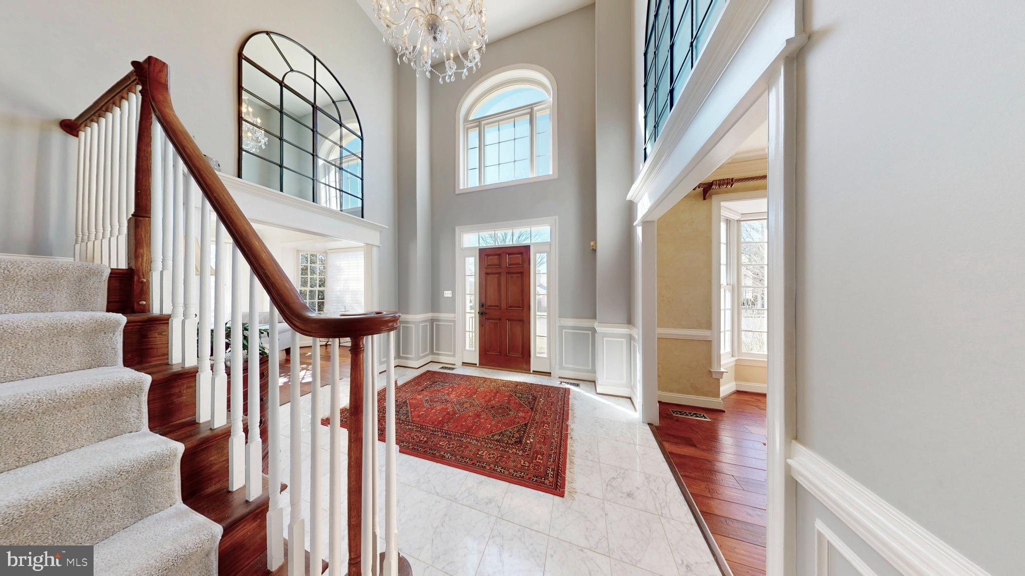 9728 Middleton Ridge Road Vienna, VA 22182 - Photo 2 of 81 a view of an entryway with wooden floor