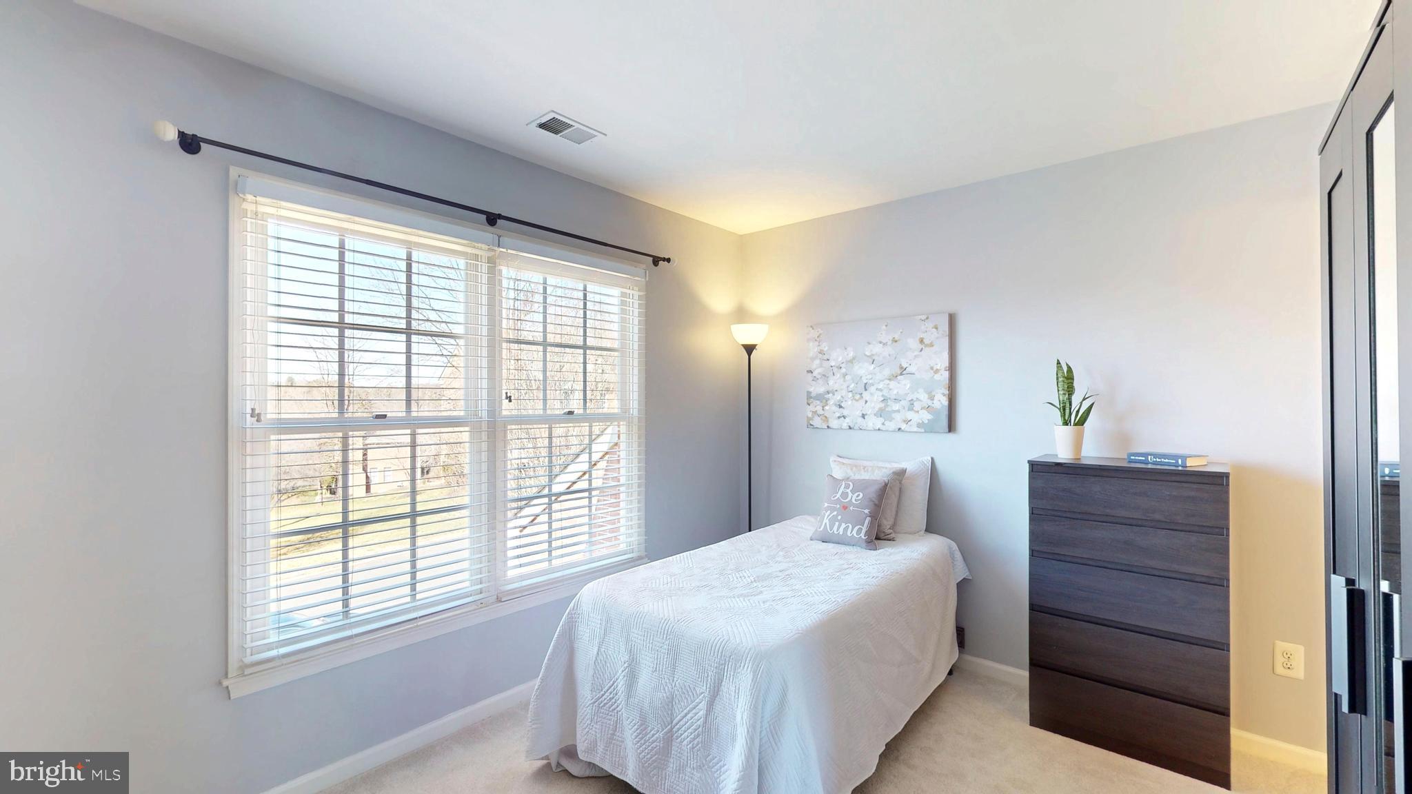 9728 Middleton Ridge Road Vienna, VA 22182 - Photo 43 of 81 a bedroom with a bed and a window