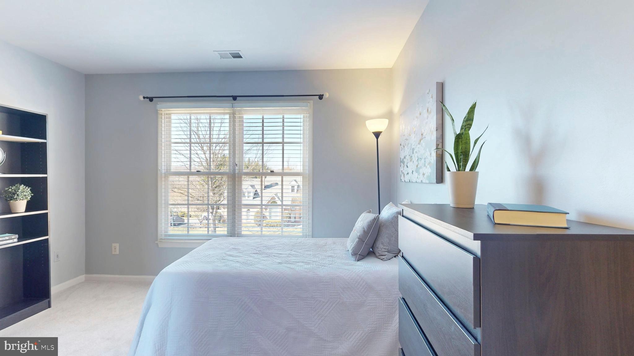 9728 Middleton Ridge Road Vienna, VA 22182 - Photo 45 of 81 a bedroom with a bed and a large window