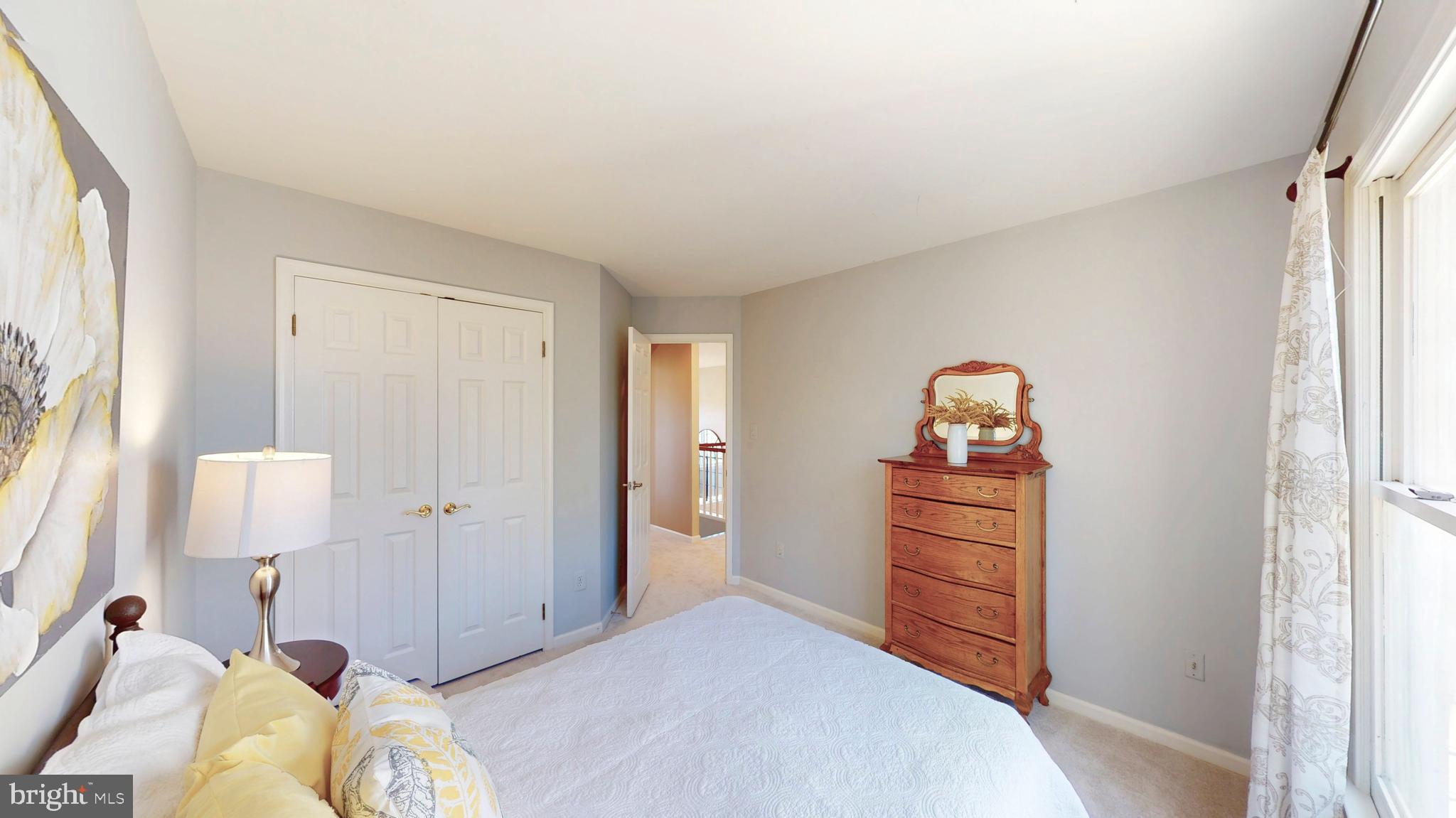 9728 Middleton Ridge Road Vienna, VA 22182 - Photo 48 of 81 a bedroom with a bed and a closet