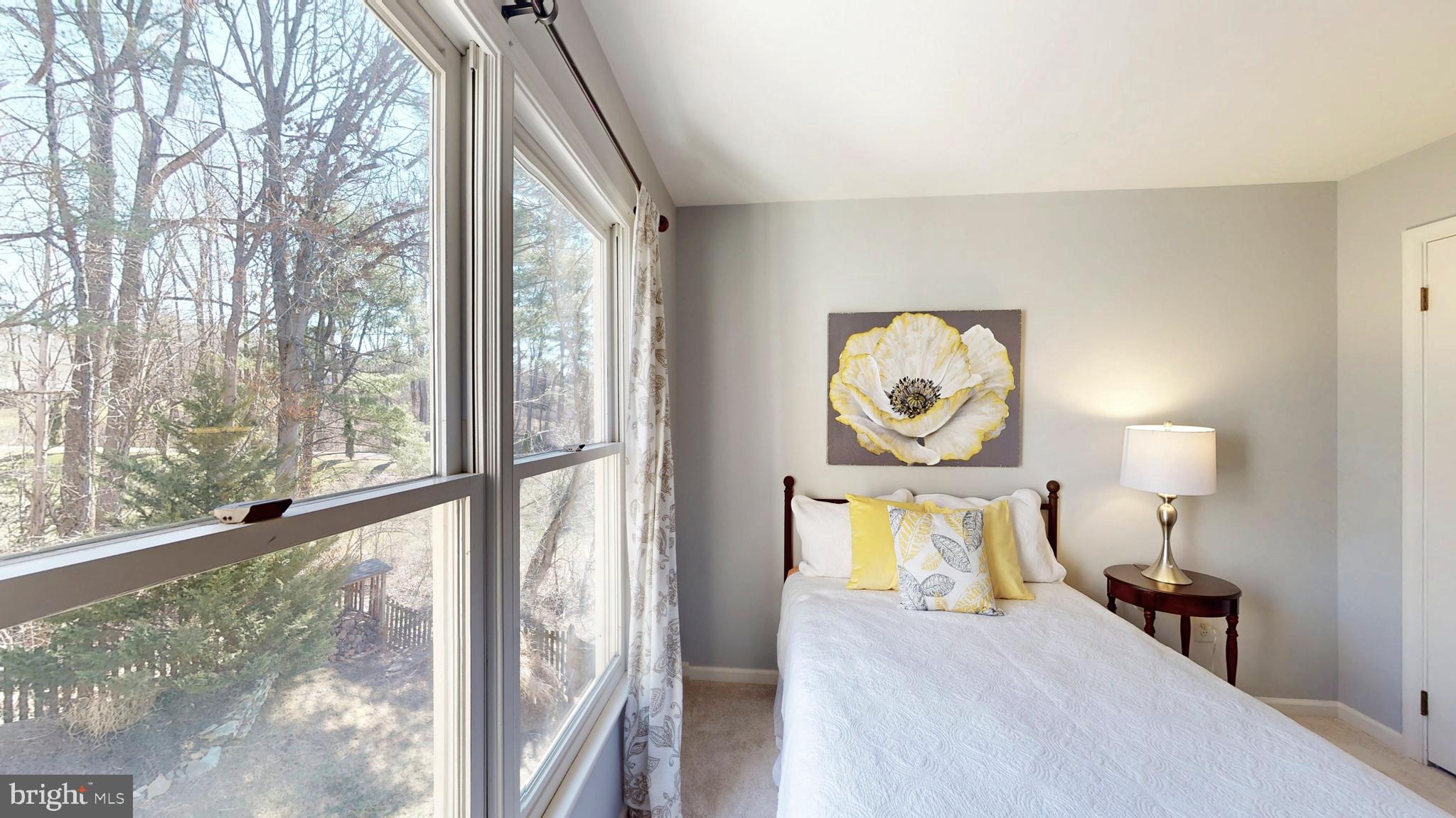 9728 Middleton Ridge Road Vienna, VA 22182 - Photo 49 of 81 a bedroom with a bed and a window