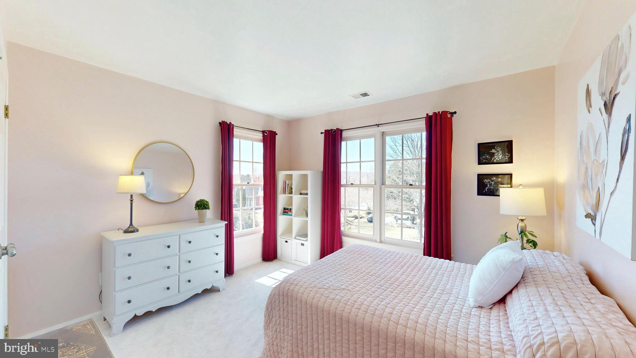9728 Middleton Ridge Road Vienna, VA 22182 - Photo 51 of 81 a bedroom with a bed dresser and a large window