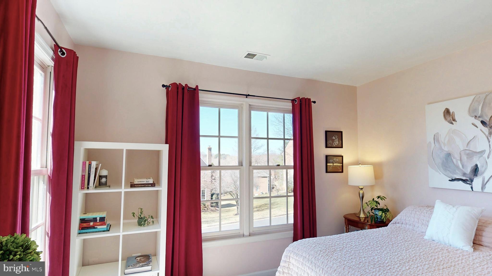 9728 Middleton Ridge Road Vienna, VA 22182 - Photo 52 of 81 a bedroom with a large bed and a window